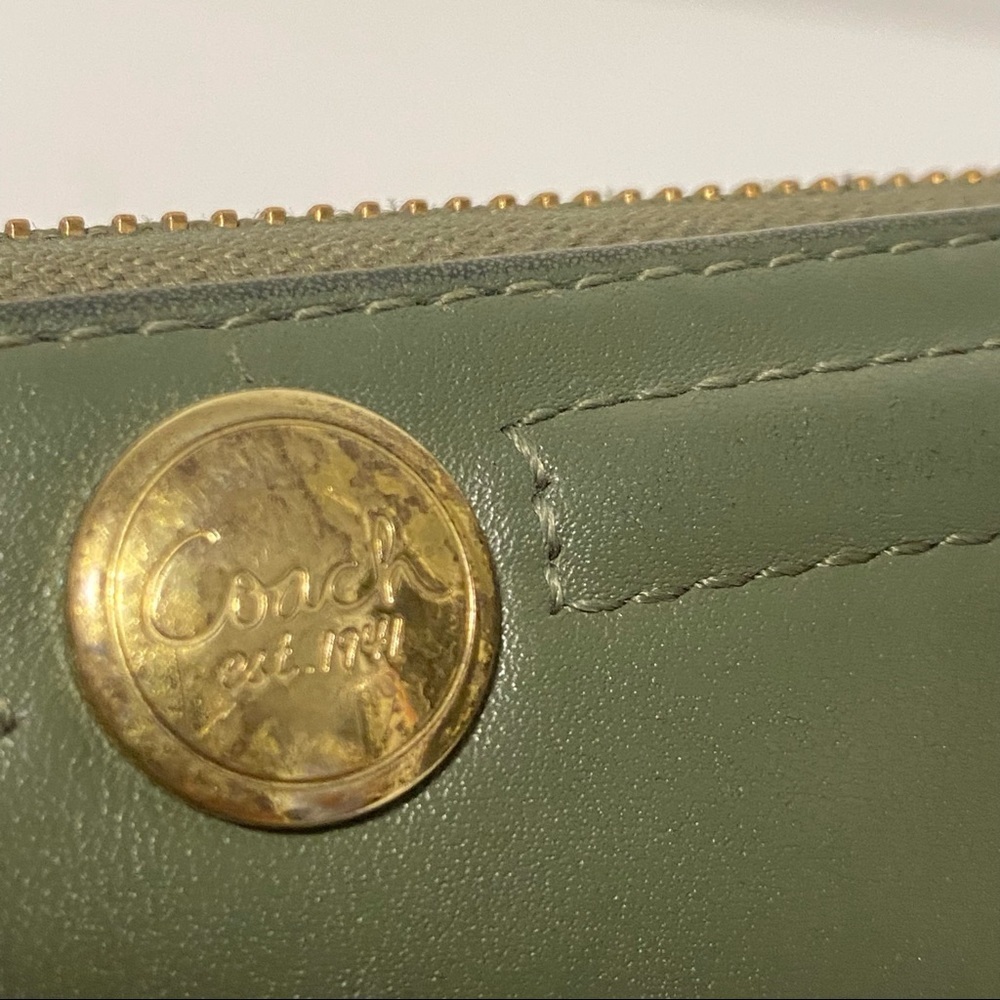 Coach. Olive leather zip around accordion wallet